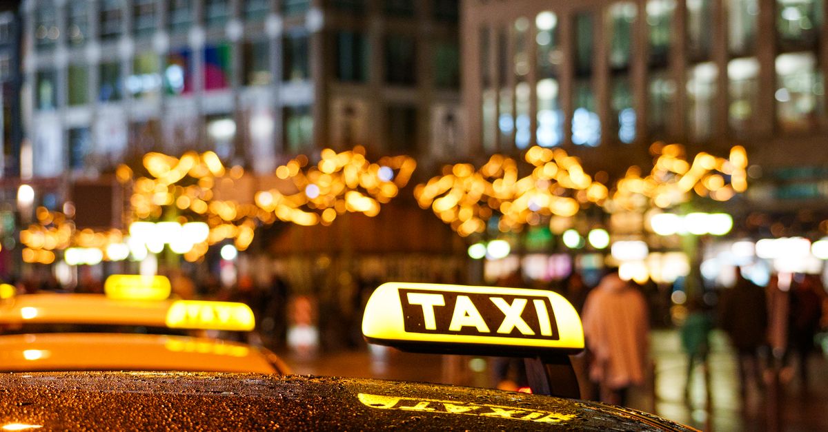 Glistening taxis at night with festive city lights, creating a vibrant urban atmosphere. — illustrating free fake cab