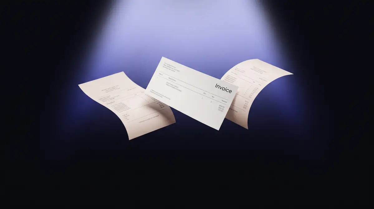 Blank receipt papers and an invoice card floating in dark space, lit from above