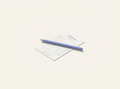 A blank receipt lying flat with a stylus resting across it, fields being filled in